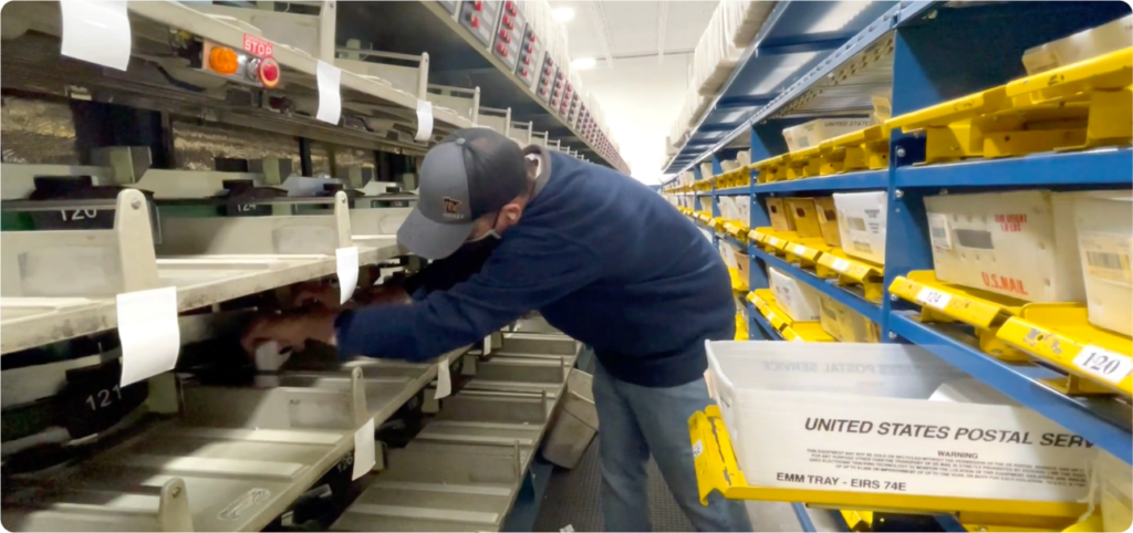 USPS Worker organizing mail